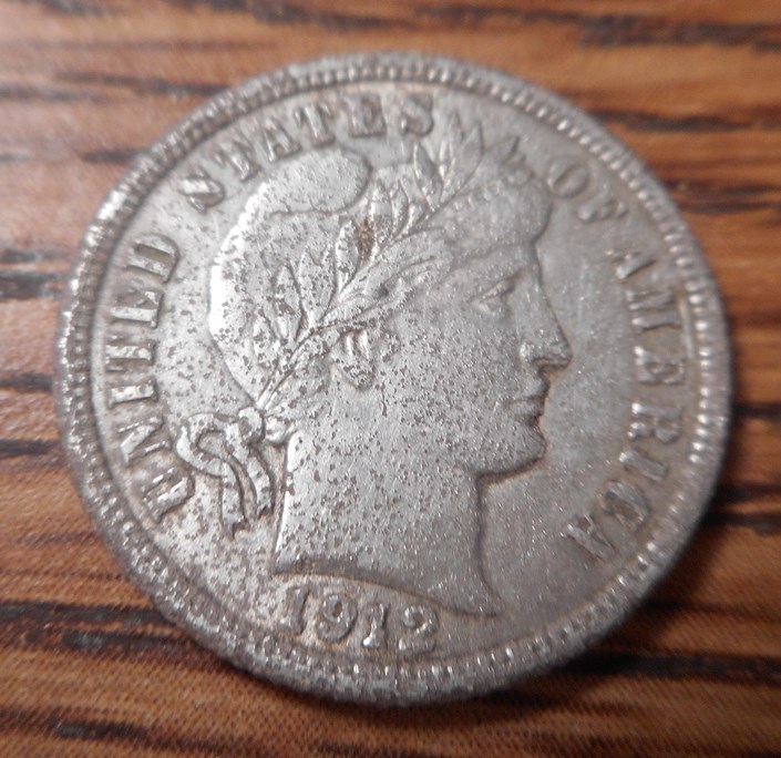 Obverse of 1912 Barber dime, found in hole with nail- great shape- too bad it's pitted.