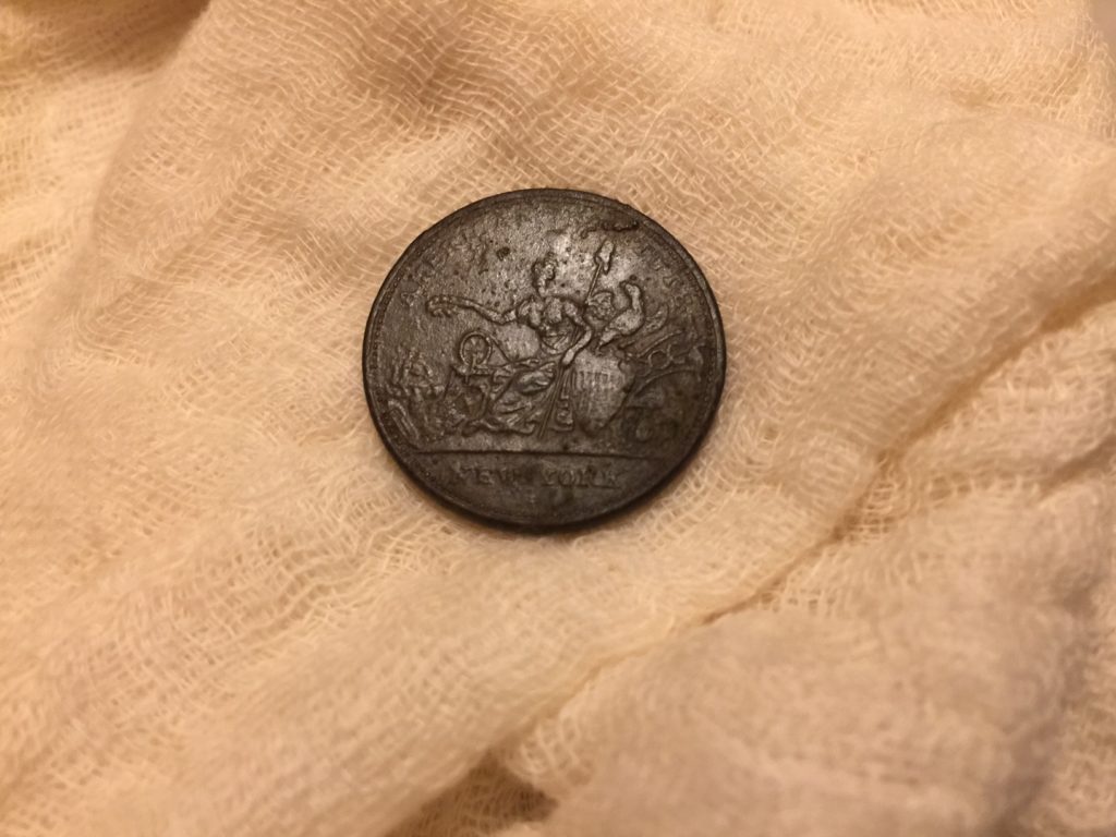 Obverse of Robinson Jones & Co token, found in 1600's yard in West Barnstable