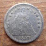 1857 Seated Liberty Half dime, stained but in nice shape