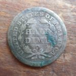 1850-O Seated Liberty Half dime, rev, stained from being stuck to a Nova Scotia penny